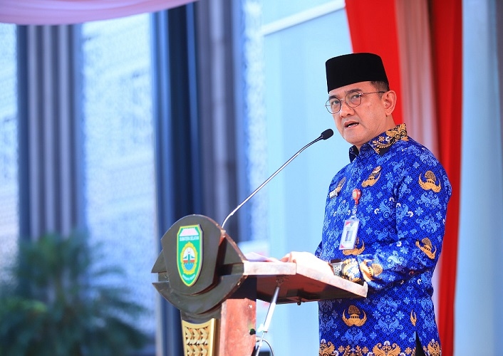 Pimpin Apel Gabungan Korpri Sumsel, Sekda Edward Candra Serahkan Santunan bagi 125 ASN Purnatugas